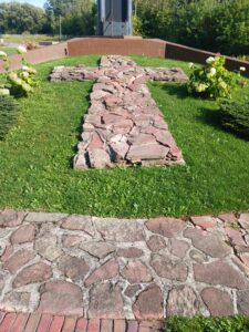 Stone cross inlay on the ground at the St. Mary's School on St. Georges Ave. Sault Ste. Marie