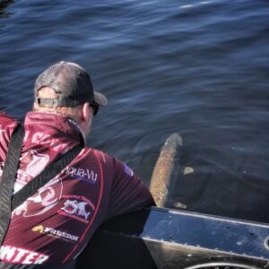 Jeremy releasing a pike off the side of his boat. He gently acclimating the fish back to it's natural habitat.