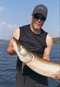 Jeremy holding a recently caught musky