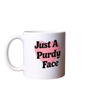 A coffee mug that says Just A Purdy Face with a heart in behind the text on the mug